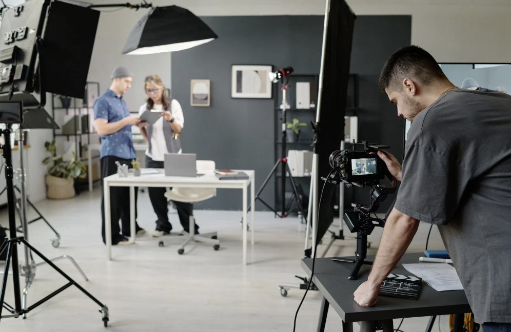 Videographer on set with lights